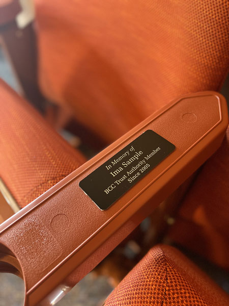 Auditorium chairs with plaques